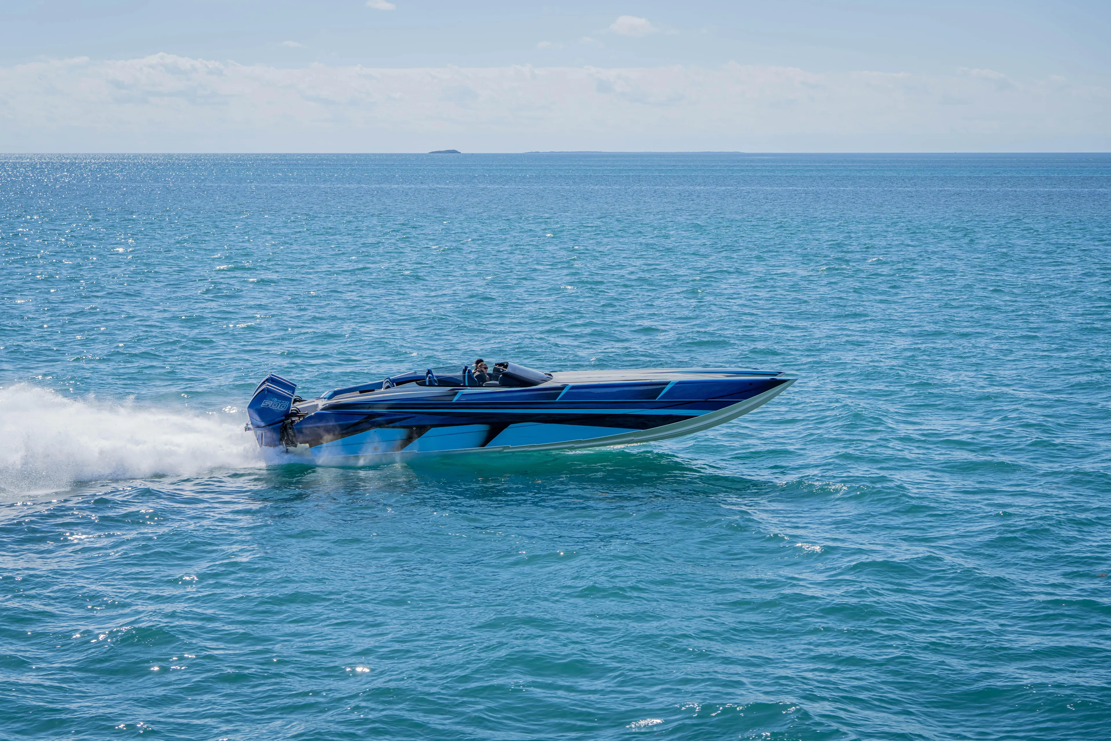  Yacht Photos Pics 2026 Nor-Tech 4000 Super Catamaran speeding on open blue ocean waters.