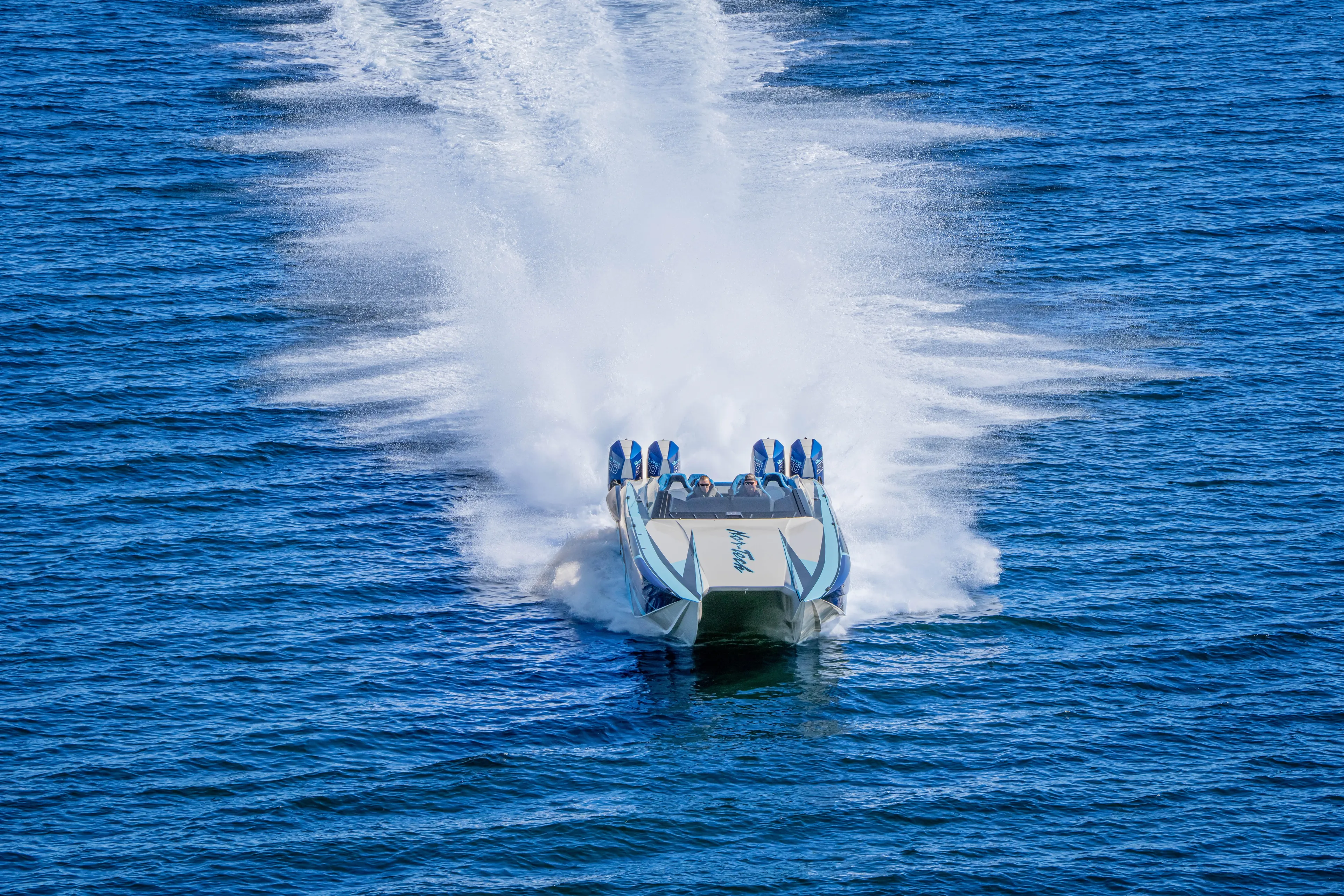  Yacht Photos Pics 2026 Nor-Tech 4000 Super Catamaran speeding across blue ocean waters.