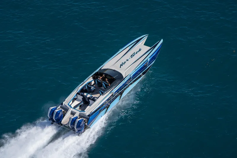  Yacht Photos Pics 2026 Nor-Tech 4000 Super Catamaran speeding on open water, showcasing sleek design.