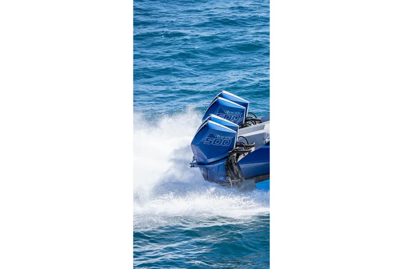  Yacht Photos Pics 2026 Nor-Tech 4000 Super Catamaran with powerful outboard engines on blue ocean.