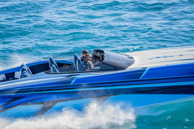  Yacht Photos Pics 2026 Nor-Tech 4000 Super Catamaran speeding on blue ocean waters.