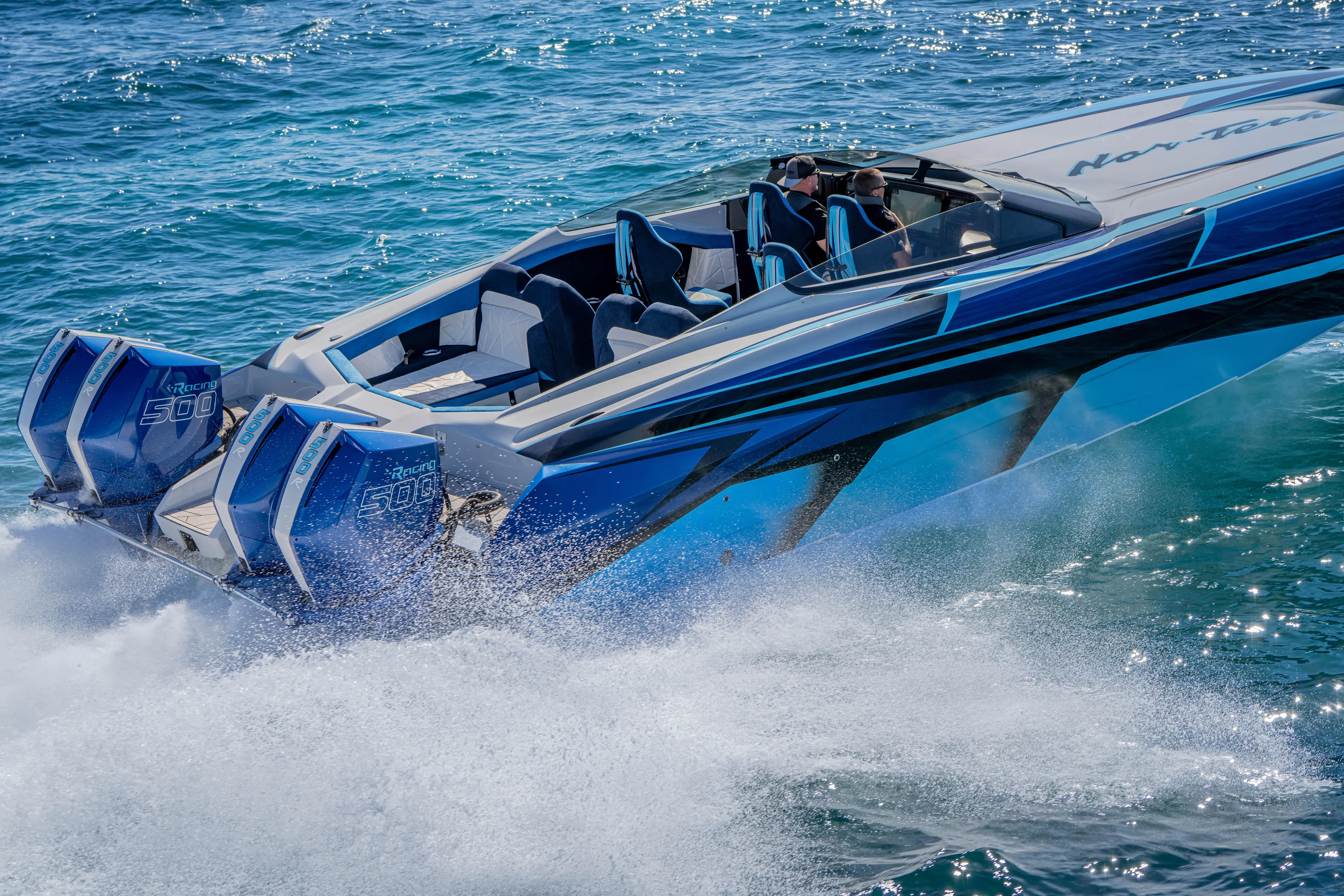  Yacht Photos Pics 2026 Nor-Tech 4000 Super Catamaran speeding on ocean waters, showcasing powerful engines.