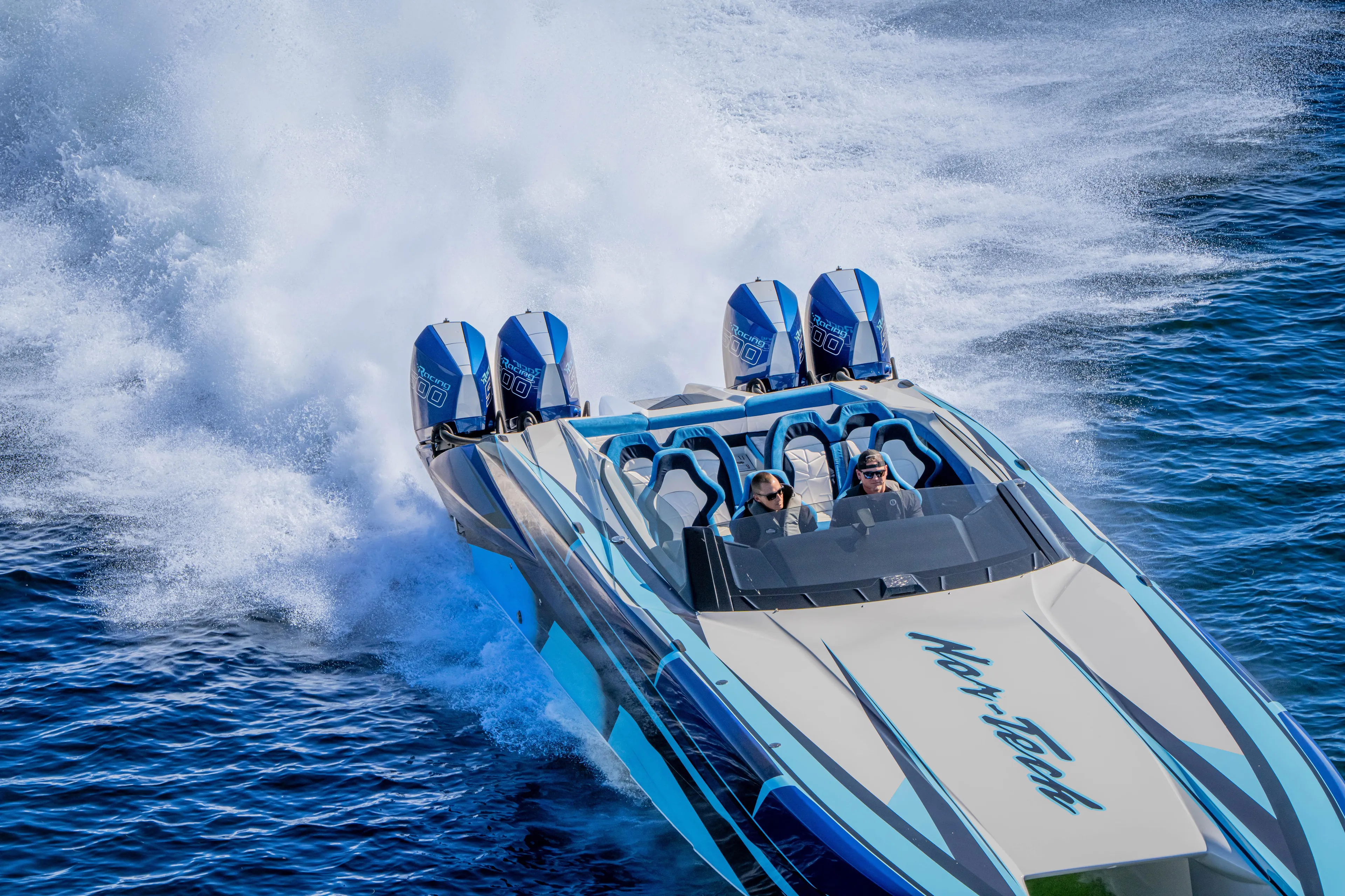  Yacht Photos Pics 2026 Nor-Tech 4000 Super Catamaran speeding on water with powerful engines.