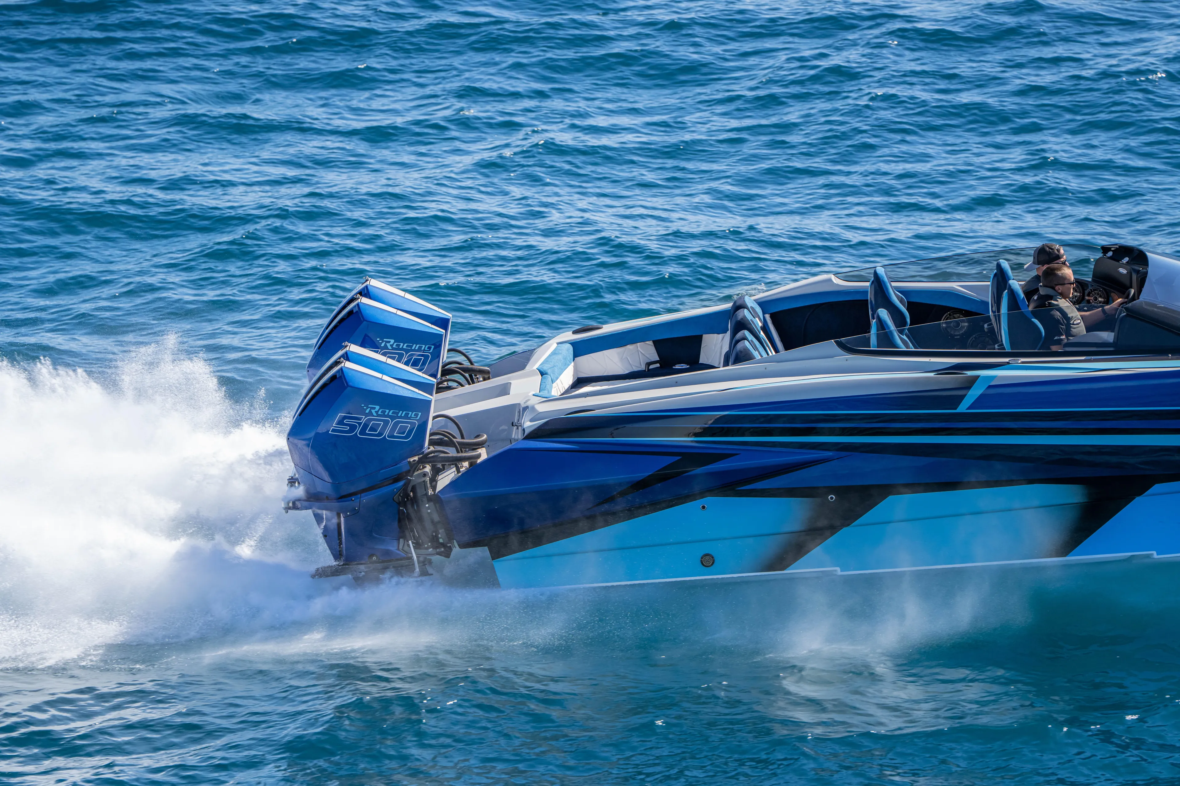  Yacht Photos Pics 2026 Nor-Tech 4000 Super Catamaran speeding on blue ocean waters.