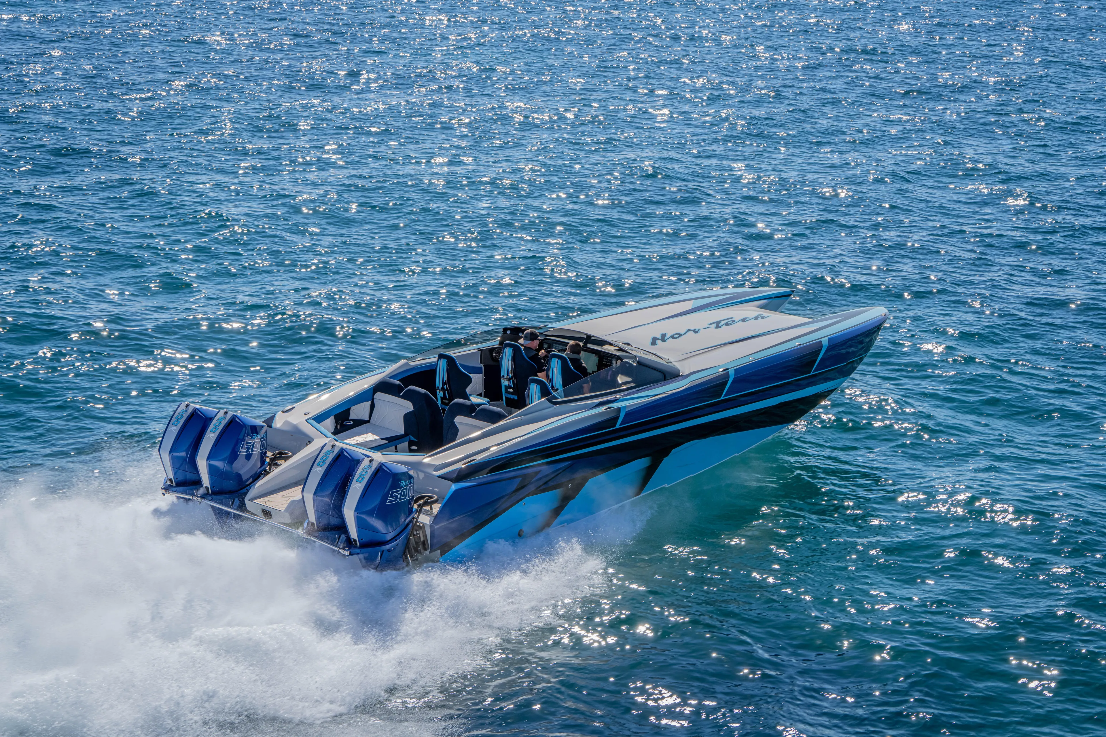  Yacht Photos Pics 2026 Nor-Tech 4000 Super Catamaran cruising on sparkling blue ocean waters.