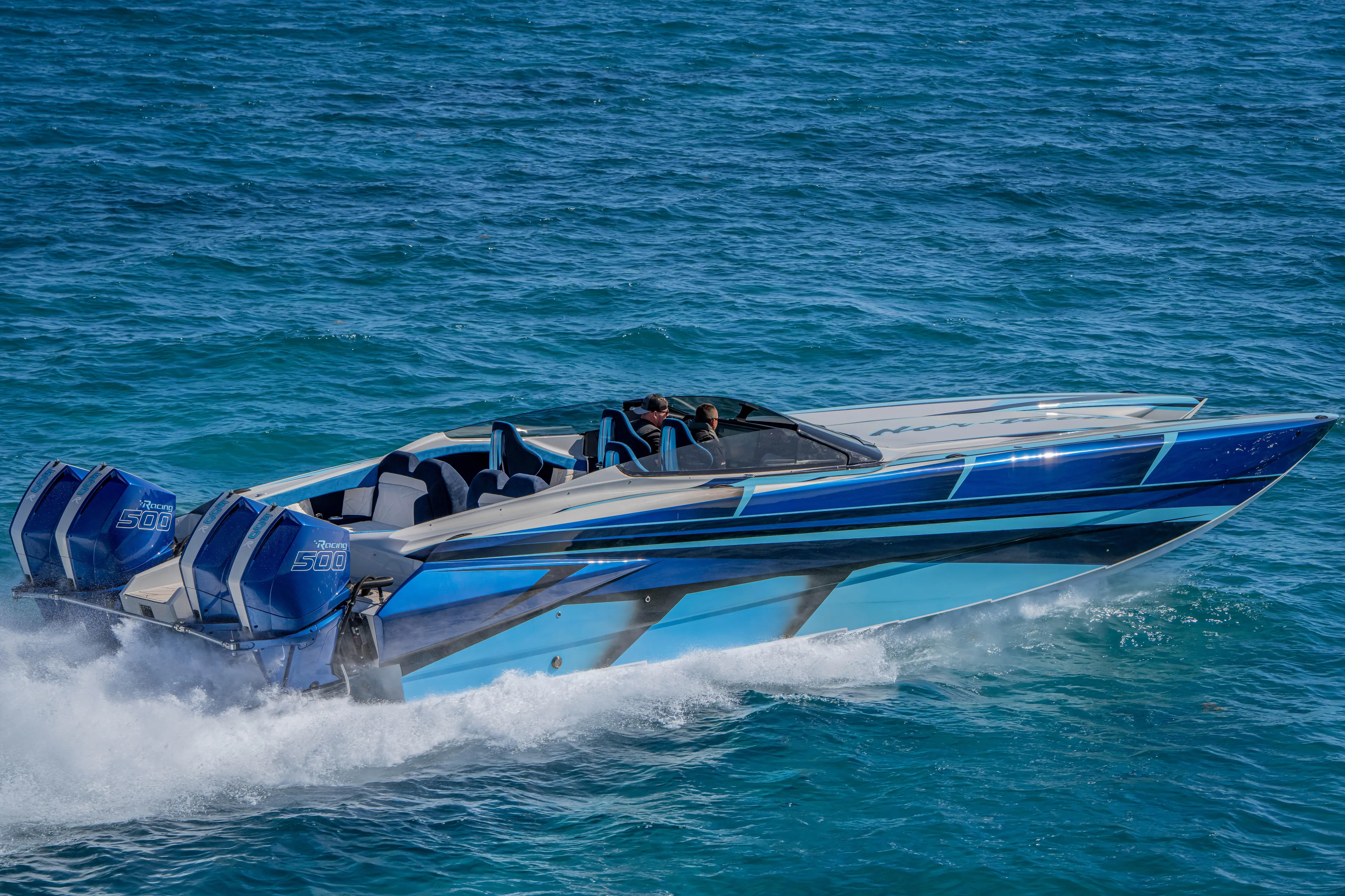  Yacht Photos Pics 2026 Nor-Tech 4000 Super Catamaran speeding on blue ocean waters.