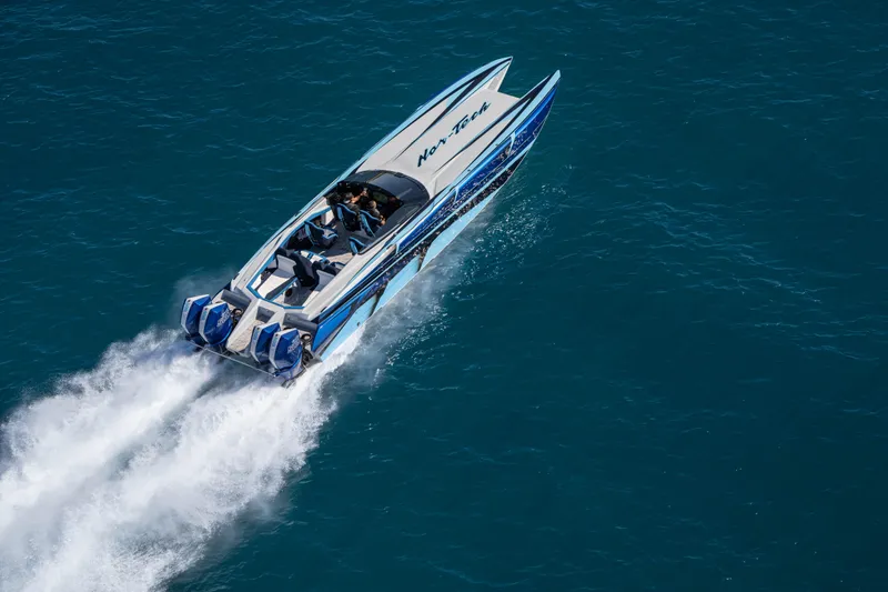  Yacht Photos Pics 2026 Nor-Tech 4000 Super Catamaran speeding on open water, showcasing sleek design.