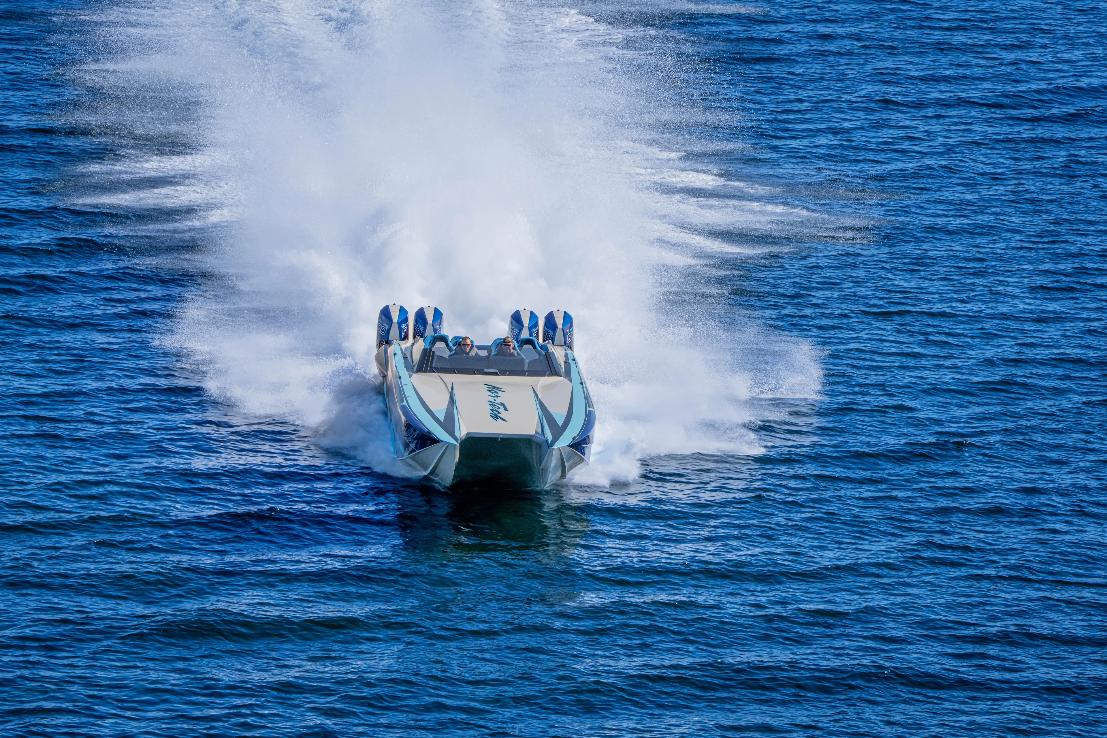  Yacht Photos Pics 2026 Nor-Tech 4000 Super Catamaran speeding on open water, creating a dramatic wake.