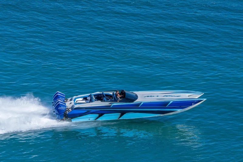  Yacht Photos Pics 2026 Nor-Tech 4000 Super Catamaran speeding on blue ocean waters.