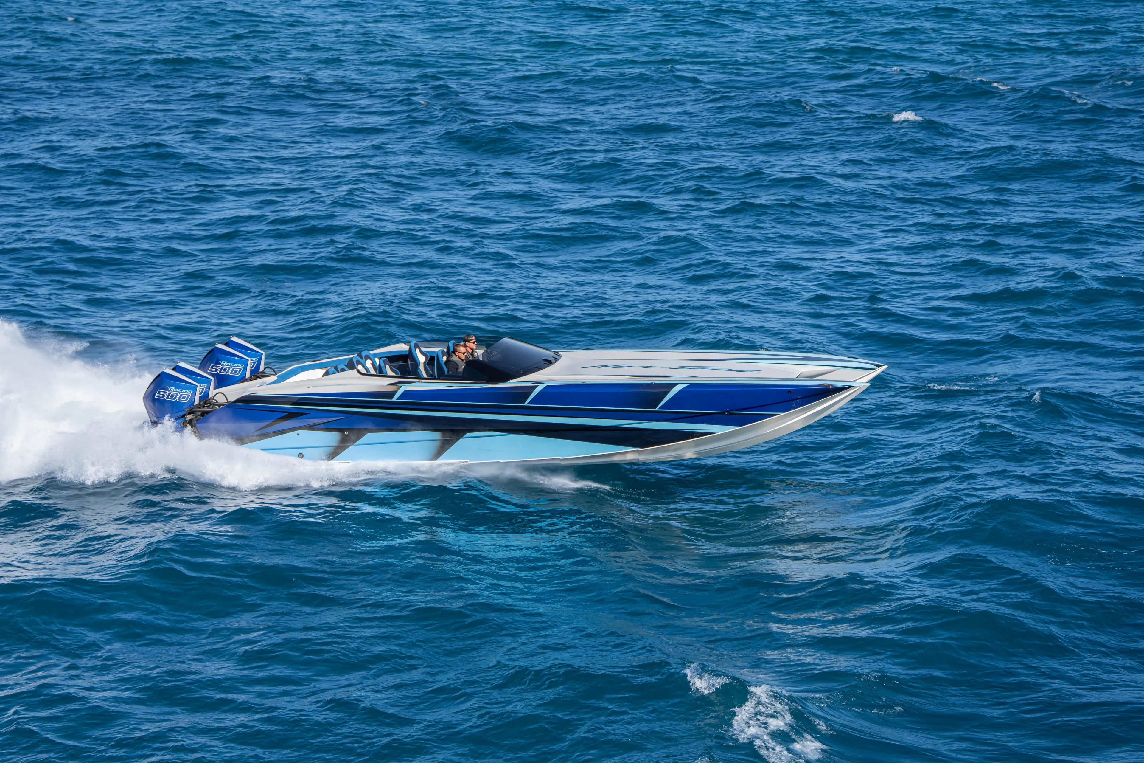  Yacht Photos Pics 2026 Nor-Tech 4000 Super Catamaran speeding on open blue ocean waters.