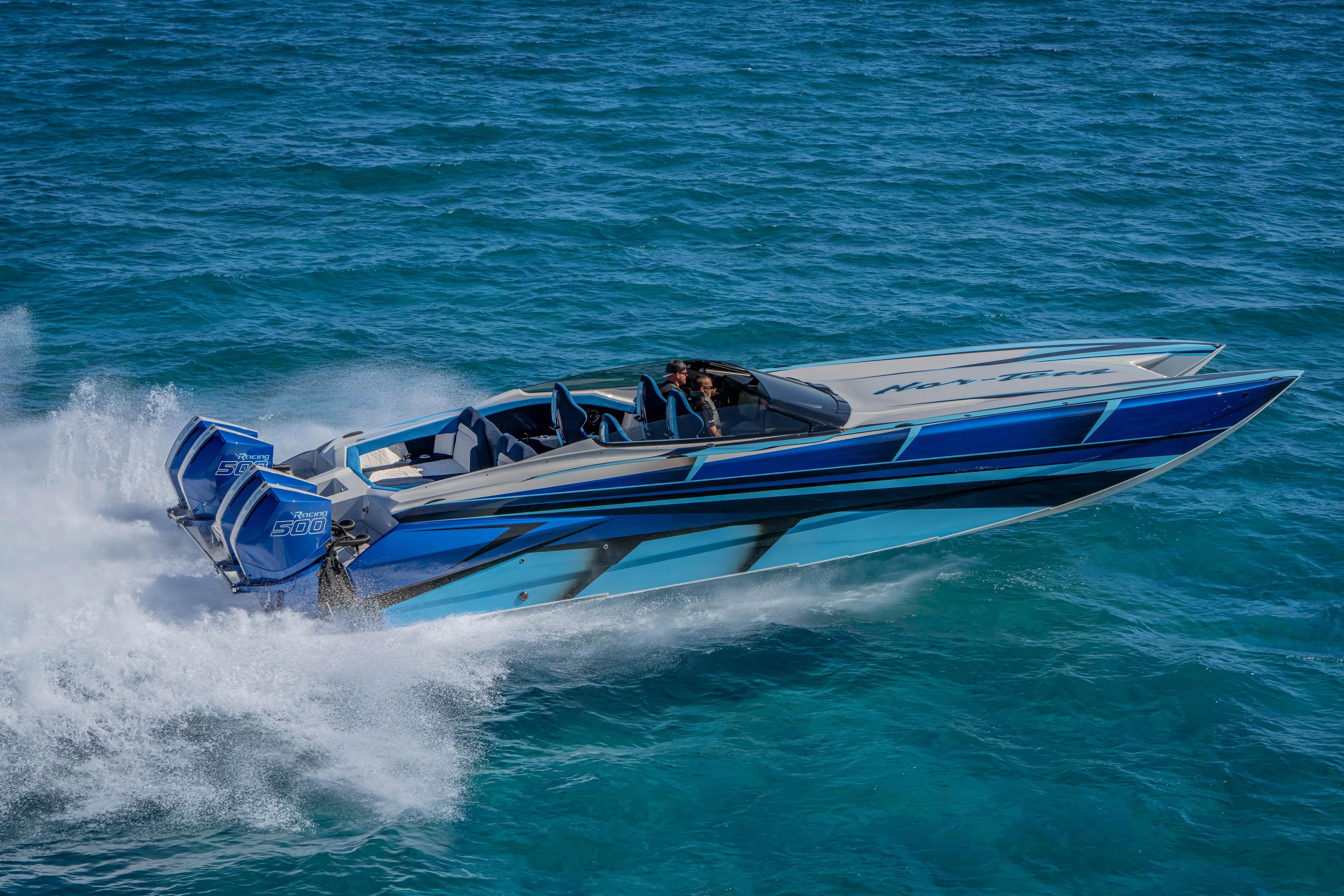  Yacht Photos Pics 2026 Nor-Tech 4000 Super Catamaran speeding on ocean waters.