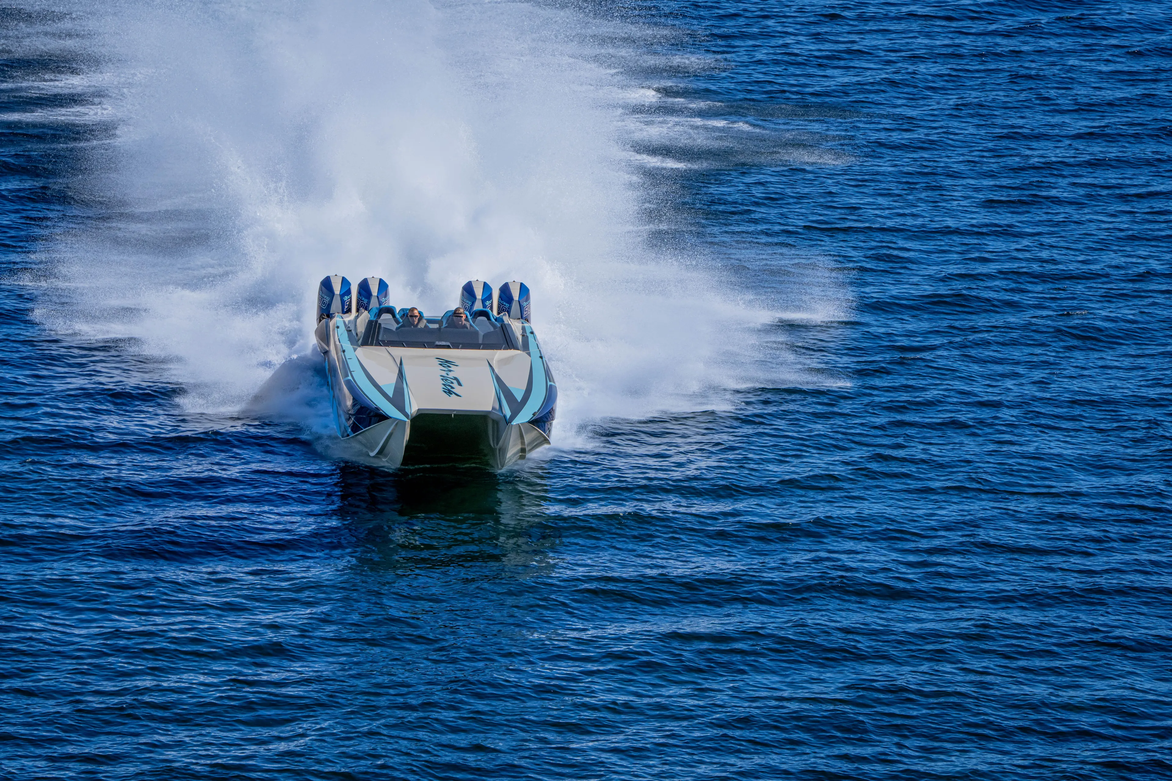  Yacht Photos Pics 2026 Nor-Tech 4000 Super Catamaran speeding on open water, creating a dramatic wake.