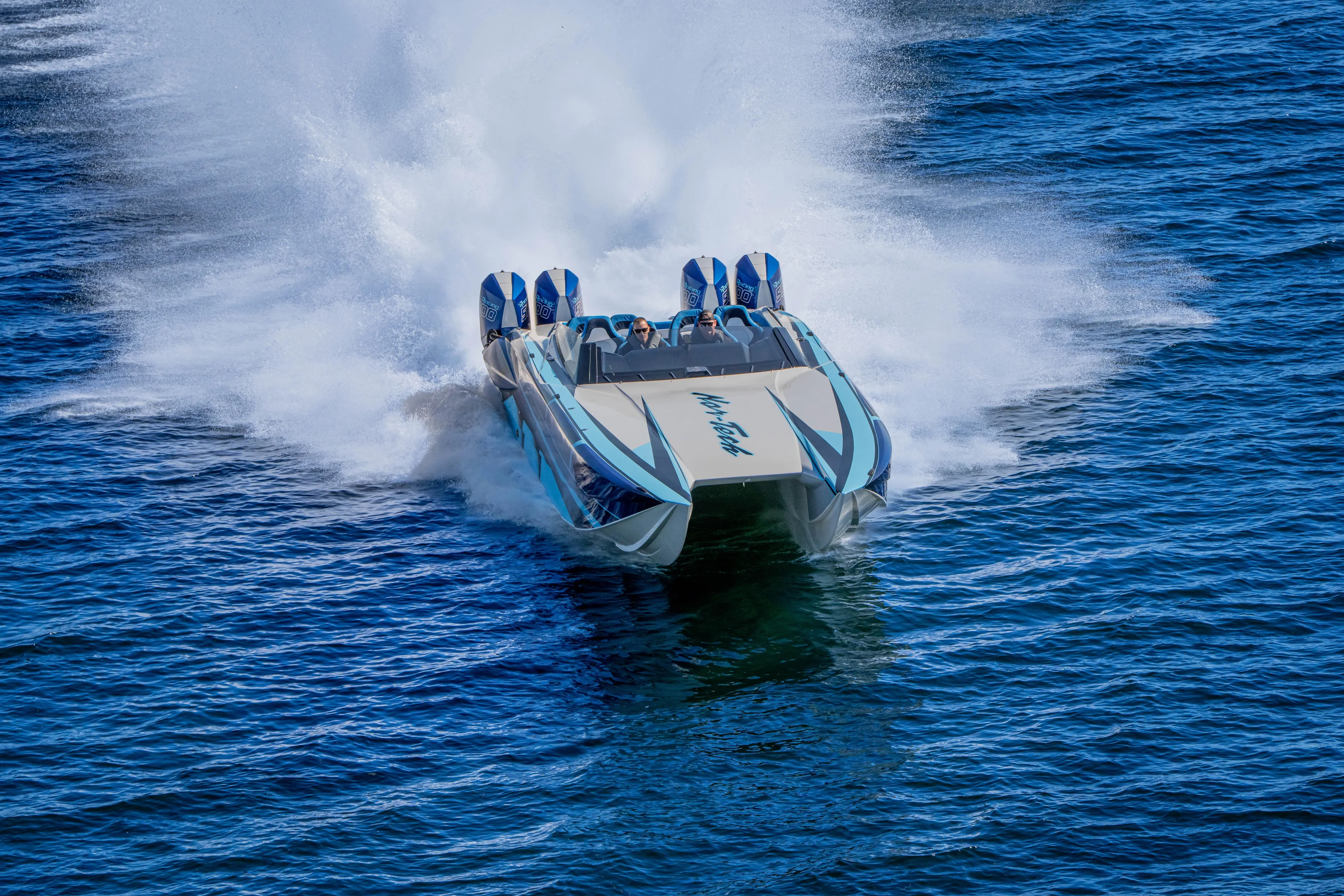  Yacht Photos Pics 2026 Nor-Tech 4000 Super Catamaran speeding on open water, creating a dramatic wake.