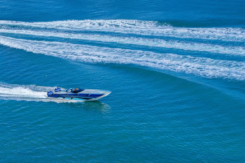  Yacht Photos Pics 2026 Nor-Tech 4000 Super Catamaran speeding on blue ocean waters.