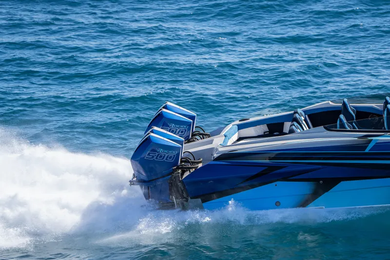  Yacht Photos Pics 2026 Nor-Tech 4000 Super Catamaran speeding on blue ocean waters.