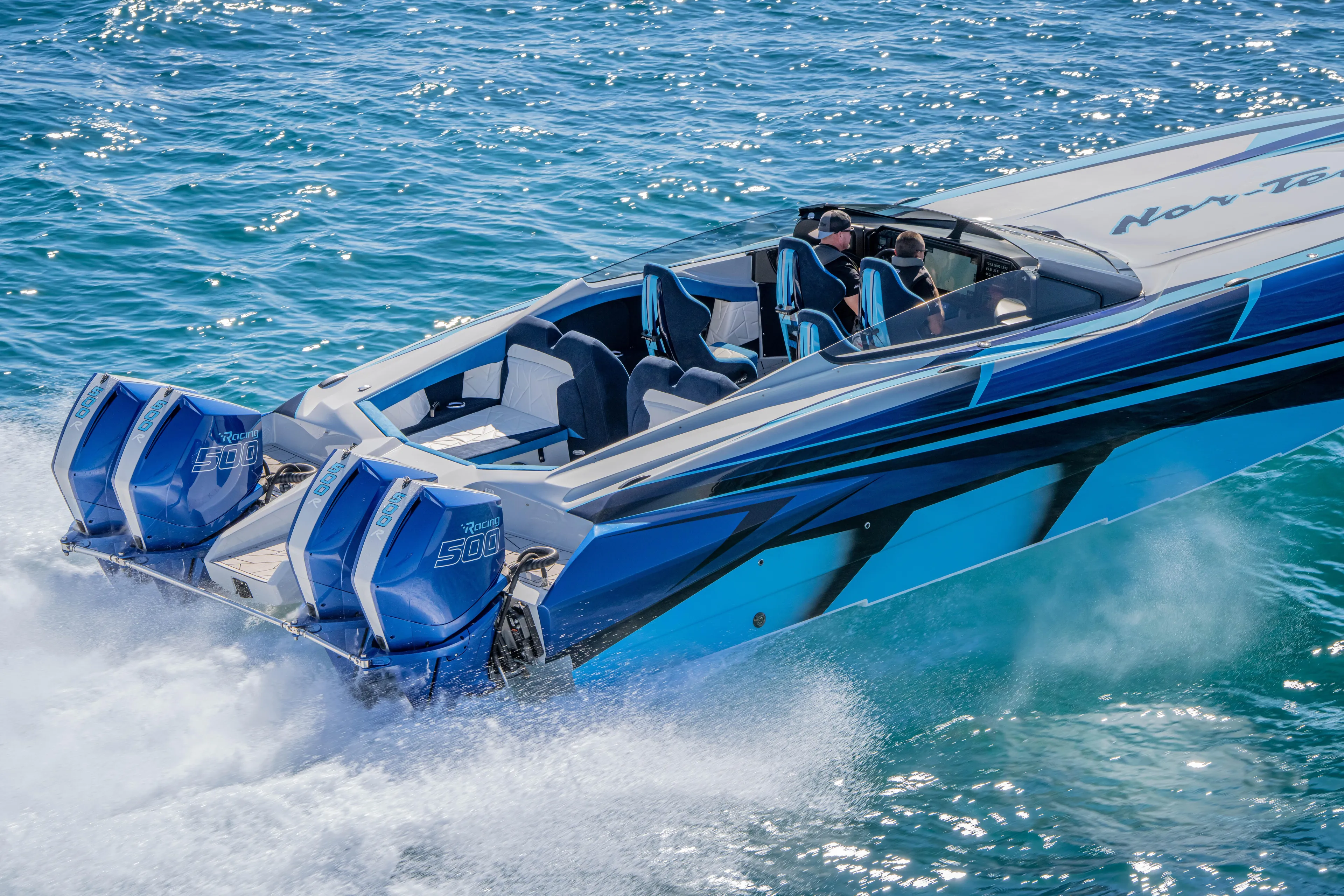  Yacht Photos Pics 2026 Nor-Tech 4000 Super Catamaran speeding on blue ocean waters.