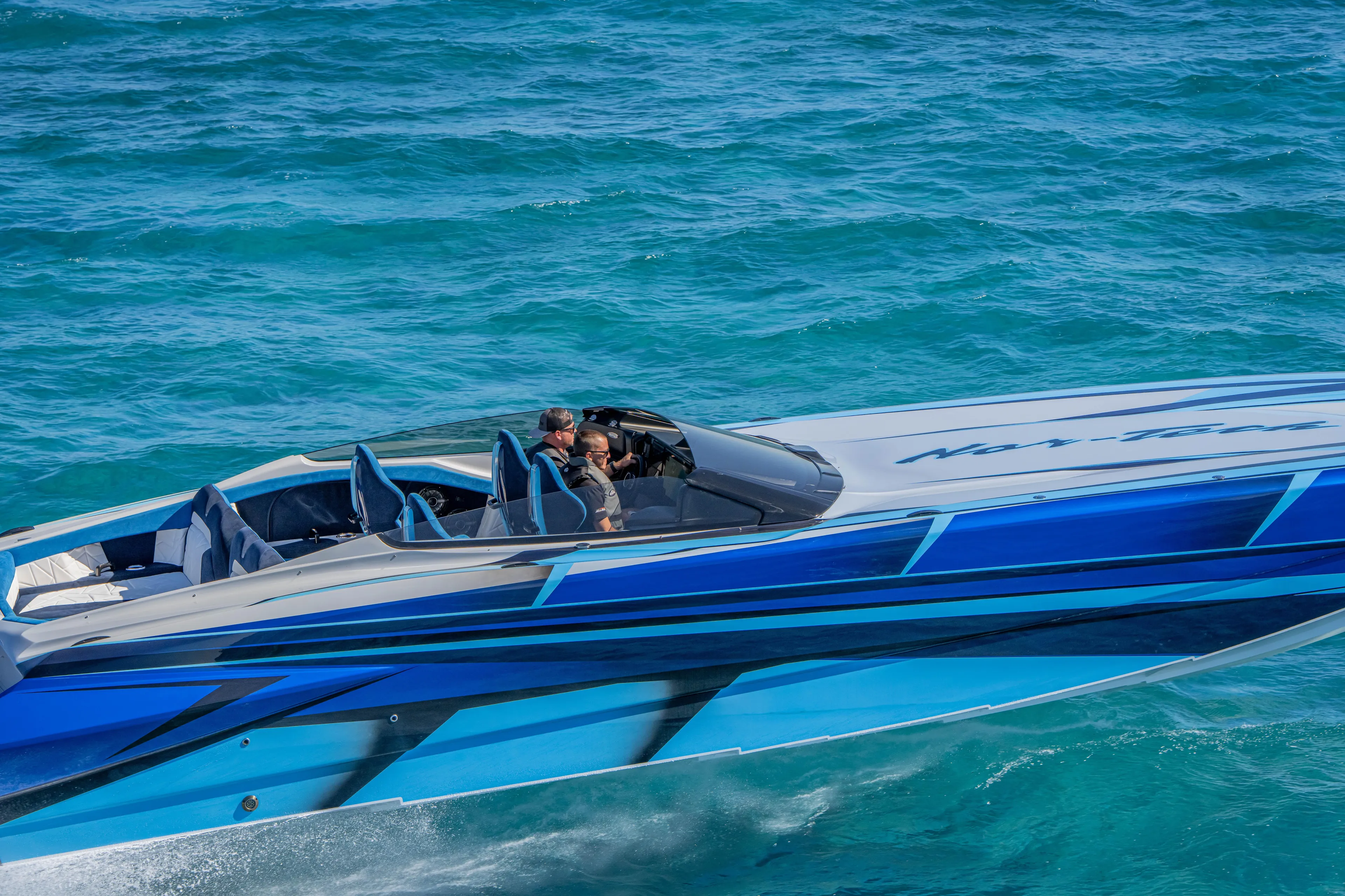  Yacht Photos Pics 2026 Nor-Tech 4000 Super Catamaran cruising on vibrant blue ocean waters.