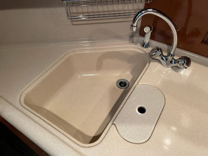  Yacht Photos Pics Kitchen sink and faucet in 2003 Sea Ray 380 Sundancer yacht.