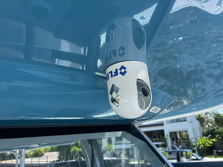 Nomad Yacht Photos Pics Close-up of a 2021 Freeman 42 LR boat's camera system under a blue canopy.