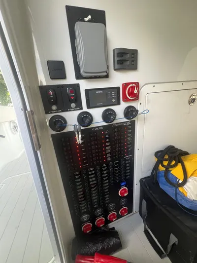 Nomad Yacht Photos Pics Control panel of a 2021 Freeman 42 LR boat with various switches and gauges.