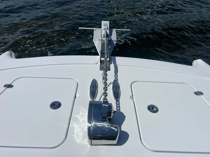 Nomad Yacht Photos Pics Bow of 2021 Freeman 42 LR boat with anchor chain and water view.