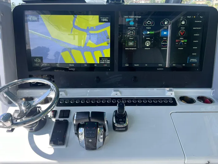Nomad Yacht Photos Pics Freeman 42 LR 2021 boat dashboard with dual Garmin displays and controls.