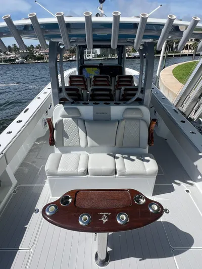 Nomad Yacht Photos Pics 2021 Freeman 42 LR boat interior with seating and fishing rod holders.