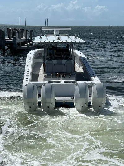 Nomad Yacht Photos Pics 2021 Freeman 42 LR boat with four engines on the water.