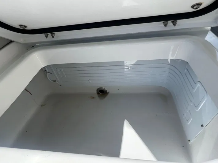 Nomad Yacht Photos Pics Empty storage compartment in a 2021 Freeman 42 LR boat.