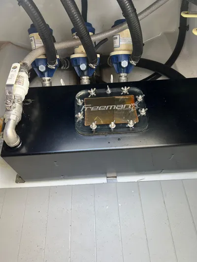 Nomad Yacht Photos Pics Freeman 42 LR 2021 boat engine compartment with hoses and components.