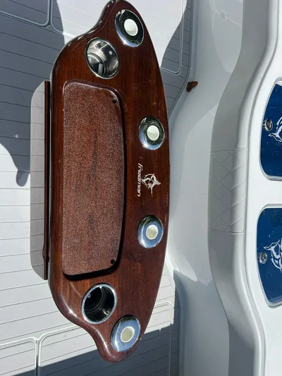 Nomad Yacht Photos Pics Wooden console with cup holders on a Freeman 42 LR boat, 2021 model.