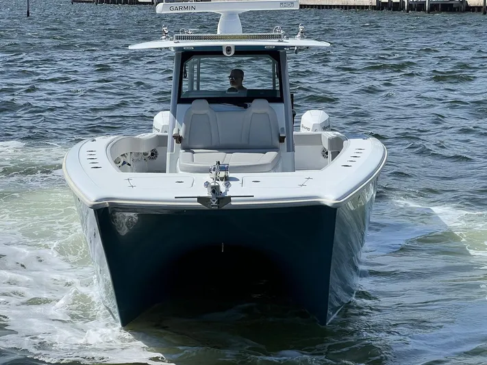 Nomad Yacht Photos Pics 2021 Freeman 42 LR boat cruising on water, featuring Garmin equipment.