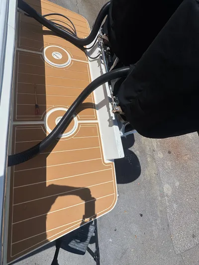 Gabrielle Yacht Photos Pics 2006 Jupiter 31 CC FWD Seating boat deck with covered engines and cables.