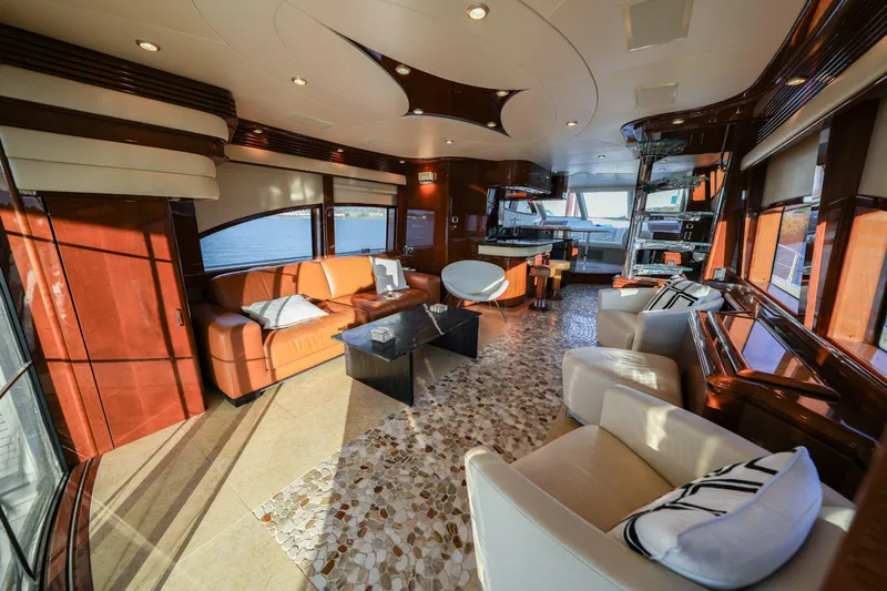  Yacht Photos Pics Luxurious interior of a 2006 Marquis 65 yacht with elegant seating and panoramic windows.