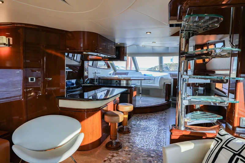  Yacht Photos Pics Luxurious interior of a 2006 Marquis 65 yacht with modern furnishings and elegant design.