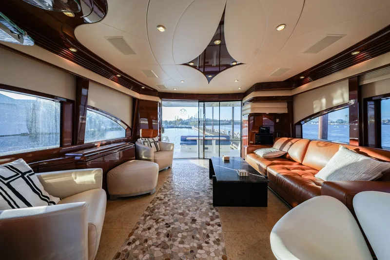  Yacht Photos Pics Luxurious interior of a 2006 Marquis 65 yacht with elegant seating and panoramic windows.