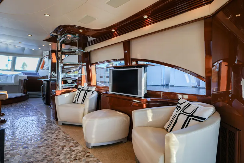  Yacht Photos Pics Luxurious interior of a 2006 Marquis 65 yacht with elegant seating and modern decor.
