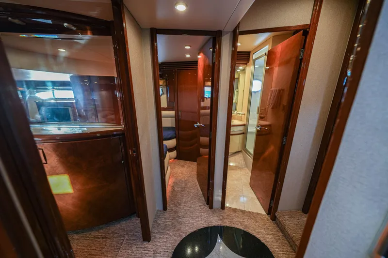  Yacht Photos Pics Luxurious interior of a 2006 Marquis 65 yacht, featuring elegant wood finishes and modern design.