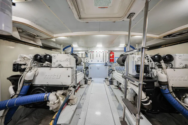  Yacht Photos Pics Engine room of a 2006 Marquis 65 yacht, featuring dual MTU engines.