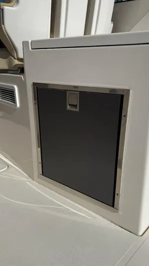  Yacht Photos Pics 2016 Pursuit DC 325 Dual Console boat interior storage compartment.