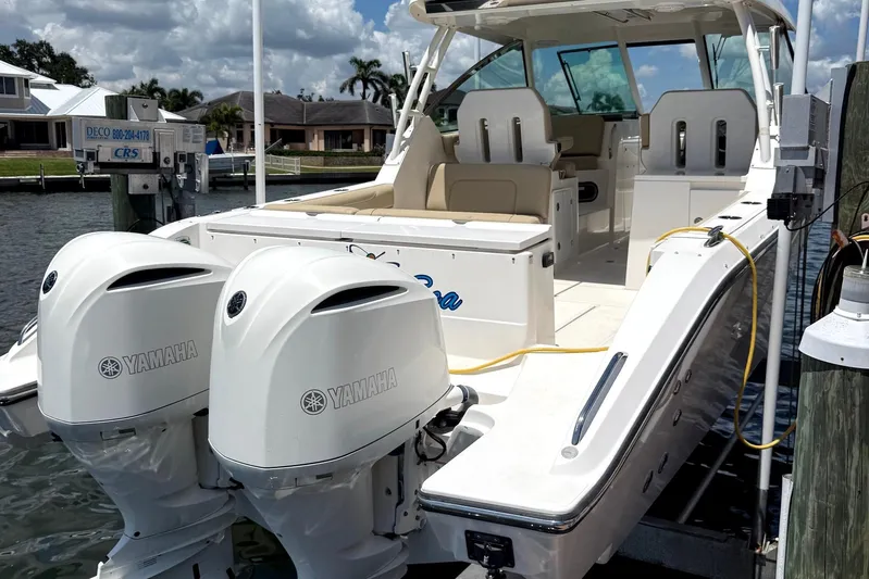  Yacht Photos Pics 2016 Pursuit DC 325 Dual Console boat with twin Yamaha engines docked at marina.