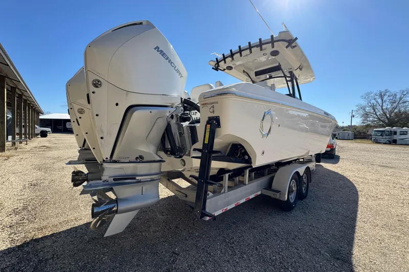  Yacht Photos Pics 2019 Fountain 34 Center Console boat with dual Mercury engines on a trailer.