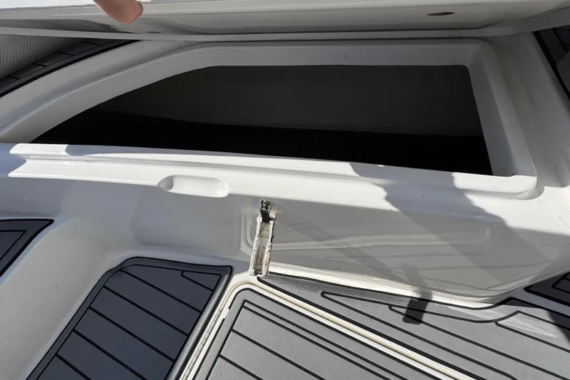  Yacht Photos Pics Open storage compartment on 2019 Fountain 34 Center Console boat deck.