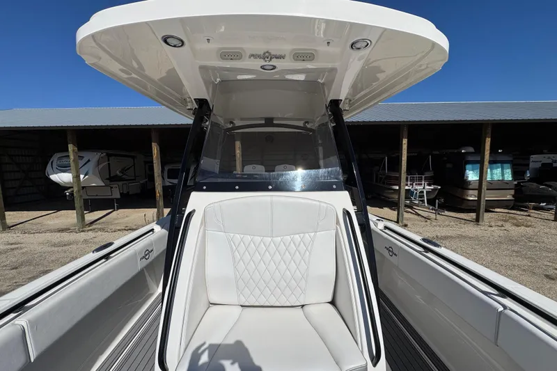  Yacht Photos Pics 2019 Fountain 34 Center Console boat with white seating and T-top in storage area.