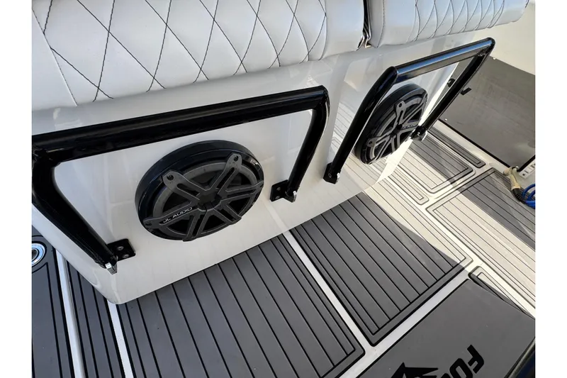  Yacht Photos Pics 2019 Fountain 34 Center Console boat interior with JL Audio speakers and cushioned seating.