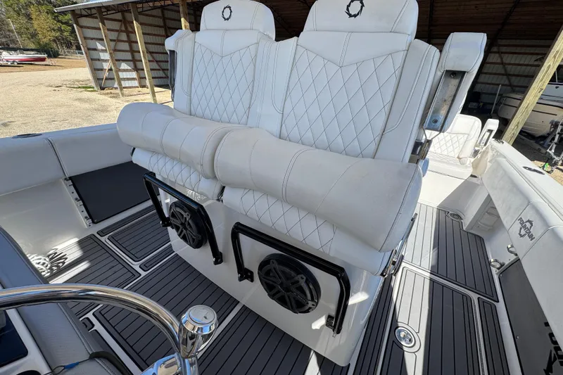  Yacht Photos Pics 2019 Fountain 34 Center Console boat with white quilted seats and marine speakers.