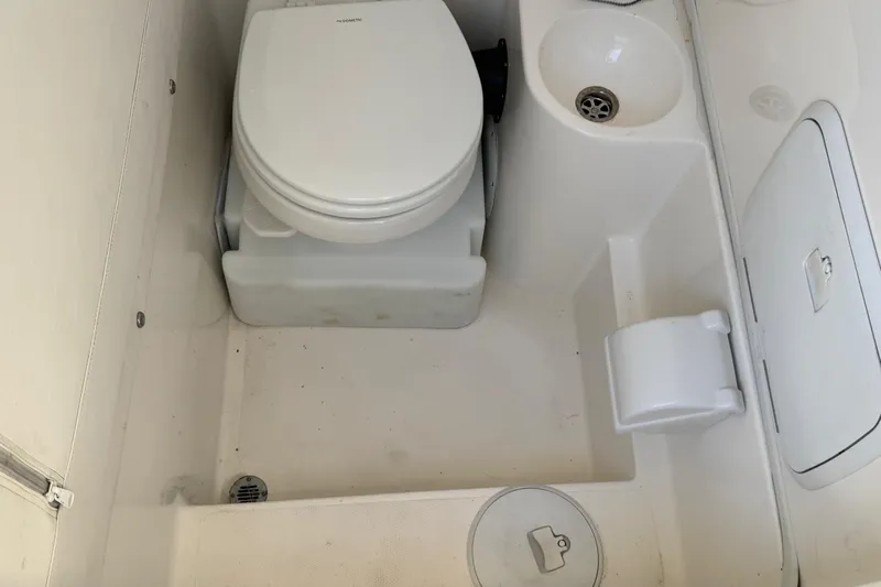  Yacht Photos Pics 2019 Fountain 34 Center Console boat bathroom with toilet and sink.