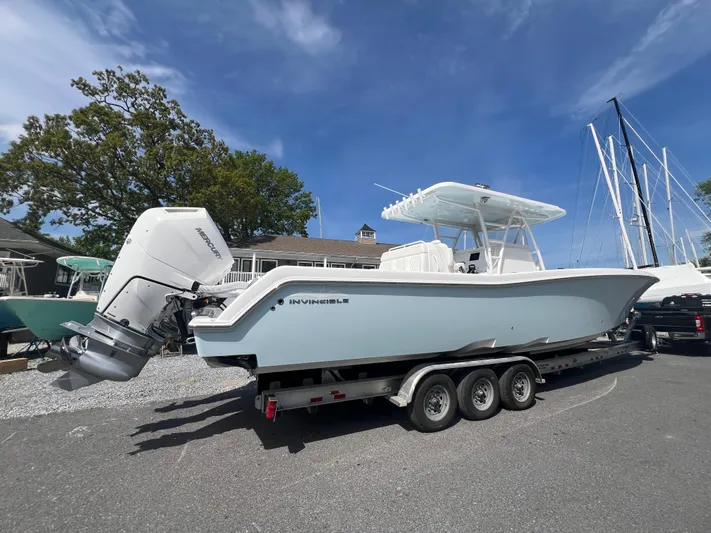 Dealer Demo Yacht Photos Pics 2024 Invincible 39 Open Fisherman boat on a trailer, side view.