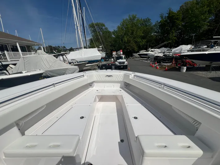 Dealer Demo Yacht Photos Pics 2024 Invincible 39 Open Fisherman boat at marina, bow view.