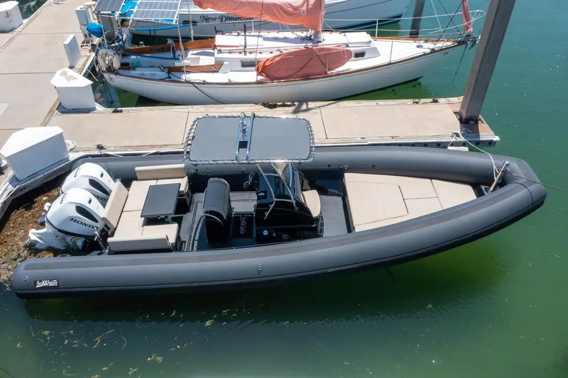  Yacht Photos Pics 2023 Sea Water PHANTOM 280 boat docked, featuring sleek design and dual engines.